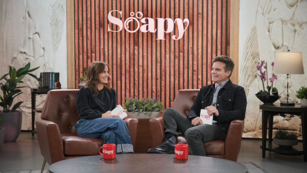 Rebecca Budig & Greg Rikaart Explain Idea Behind ‘Soapy’ Podcast, Shares “Love and Reverence, and Respect” For Genre Rebecca Budig, Greg Rikaart, Soapy Hosted by Rebecca Budig and Greg Rikaart, Podcast